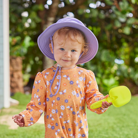 baby girl in swim hat|daybreak