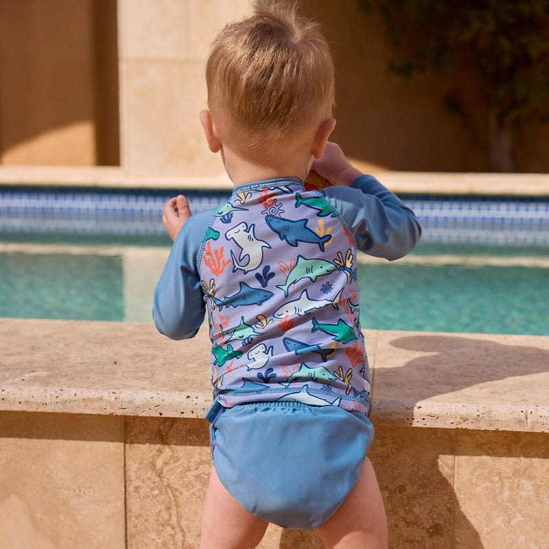 back of baby boy playing in pool in full zip rashguard|reef-sharks