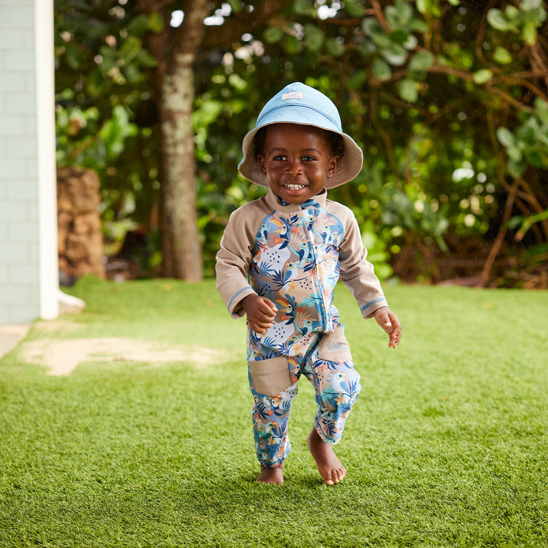 baby boy running in sun & swim suit|toucan-tropics