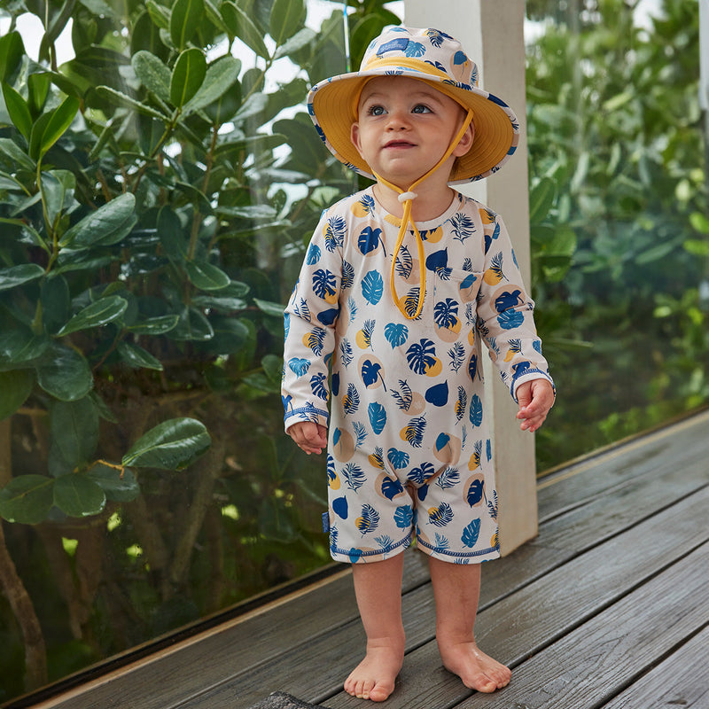 baby boy on balcony in swim hat|dino-stars