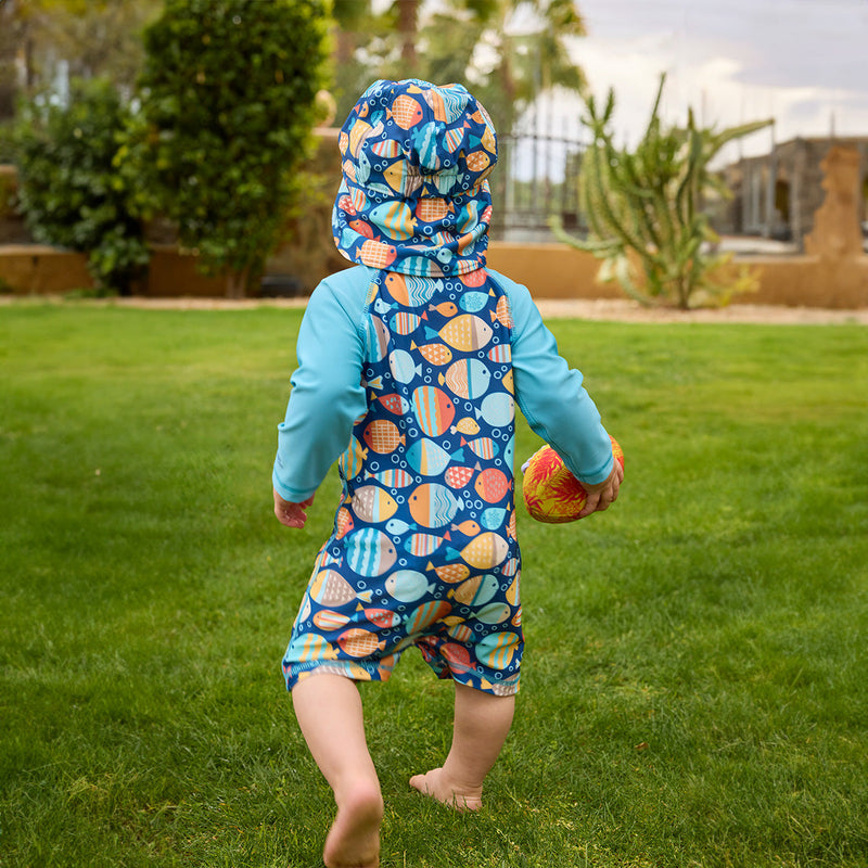 baby boy running away in swim flap hat|fish-parade