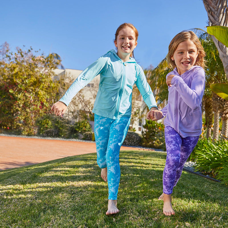 Girls playing in UV Skinz's girl's zip-up hoodies