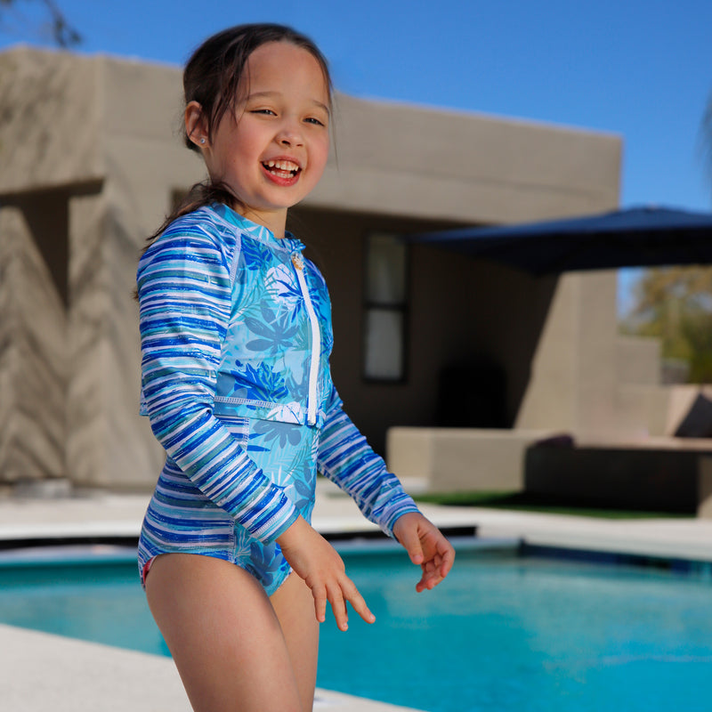 girl laughing by pool in girls 2 piece swimsuit shrug set|seaside-palms