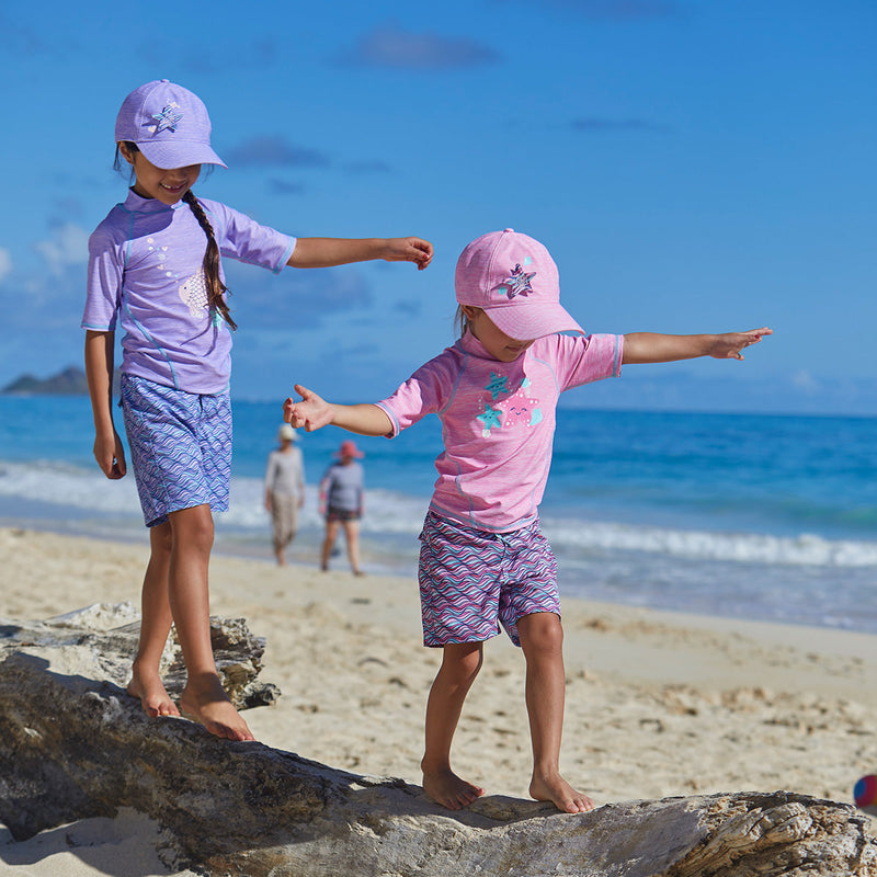 Little girls in UV Skinz's girl's short sleeve sport sun and swim shirt in sea star jaspe|sparkle-fish-jaspe