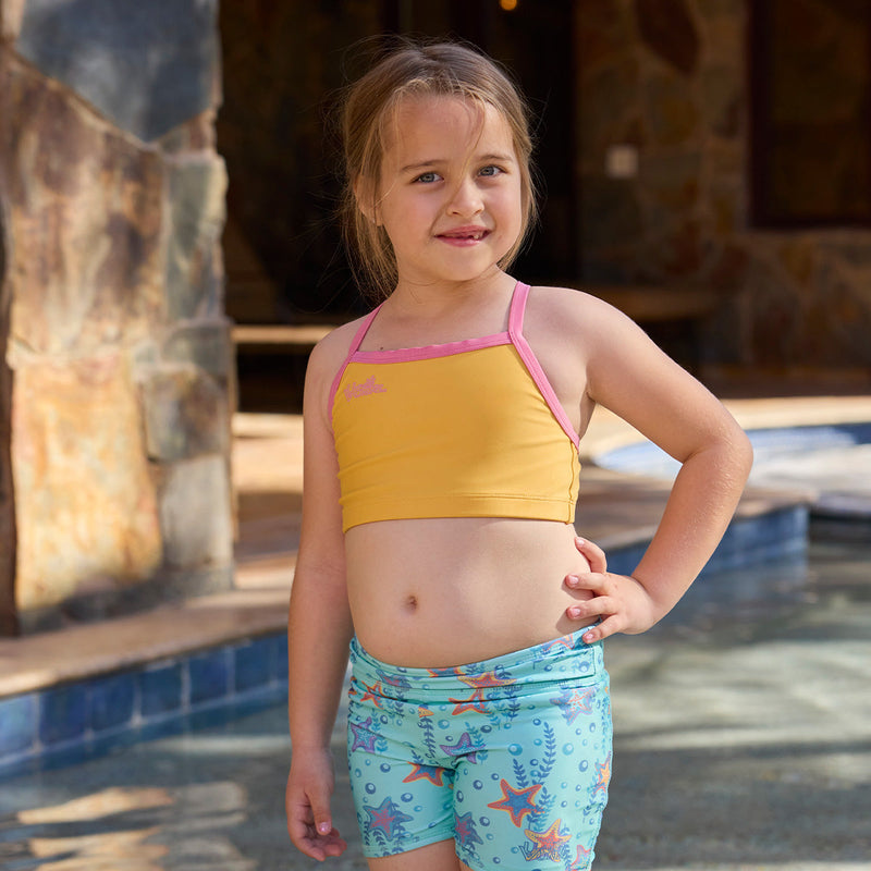 girl by pool in swim mate|marigold-wild-rose