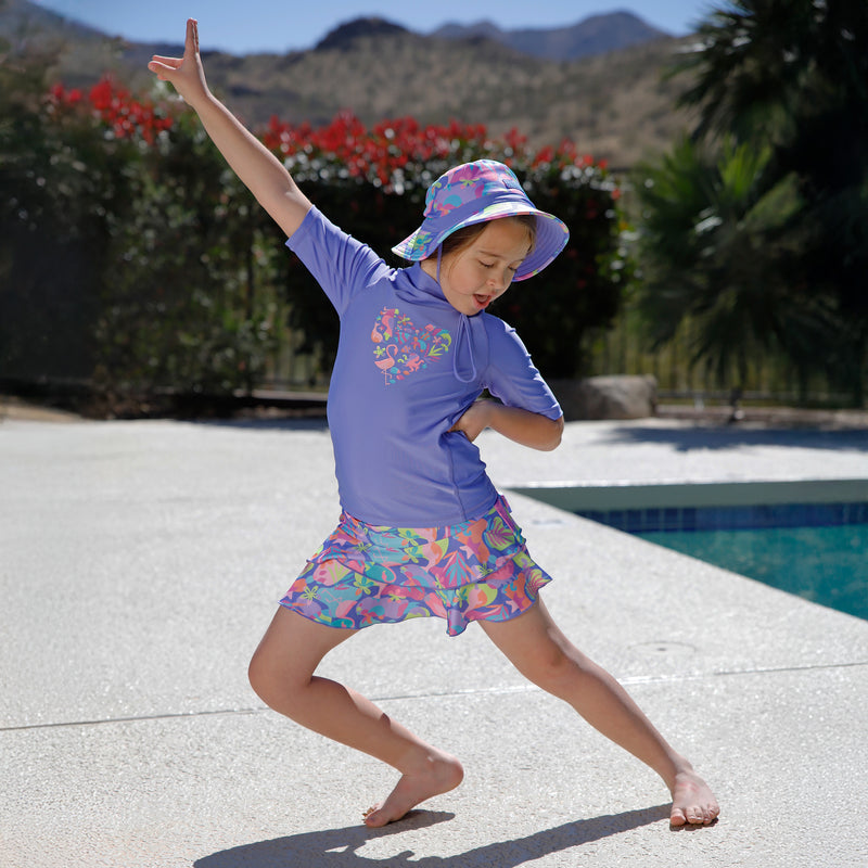 girl dancing by pool in short sleeve sunny swim shirt|sweetheart-friends