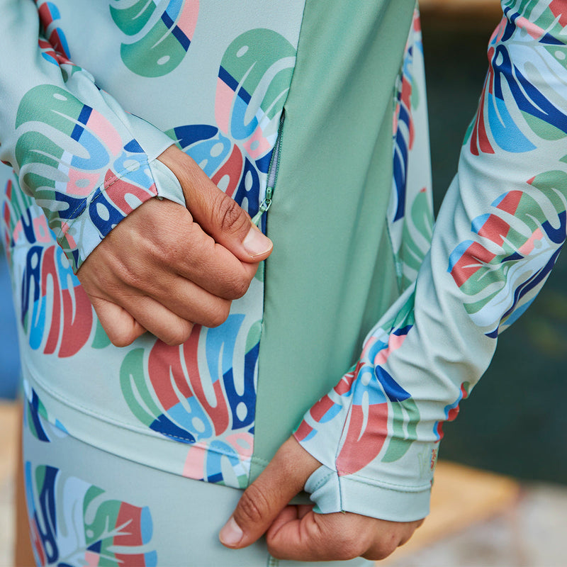 Close up of the zipper on UV Skinz's women's long sleeve crew swim shirt in sage liana luck|sage-liana-luck