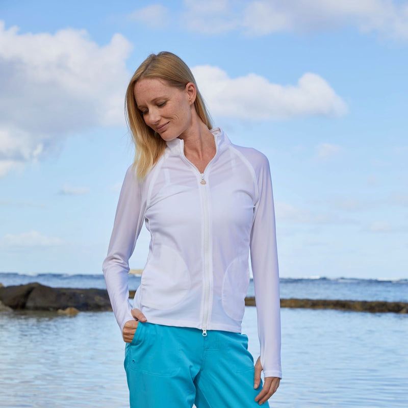 Woman wearing UV Skinz's women's swim jacket in white|white