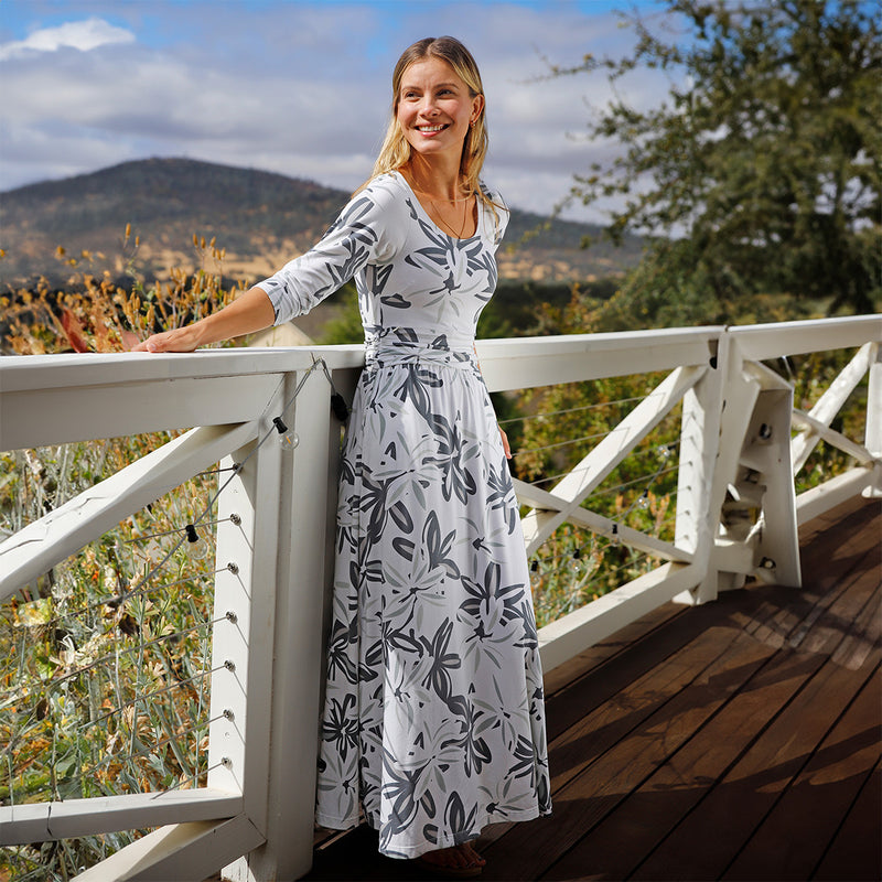 woman in scoop neck maxi dress in breezy floral|breezy-floral