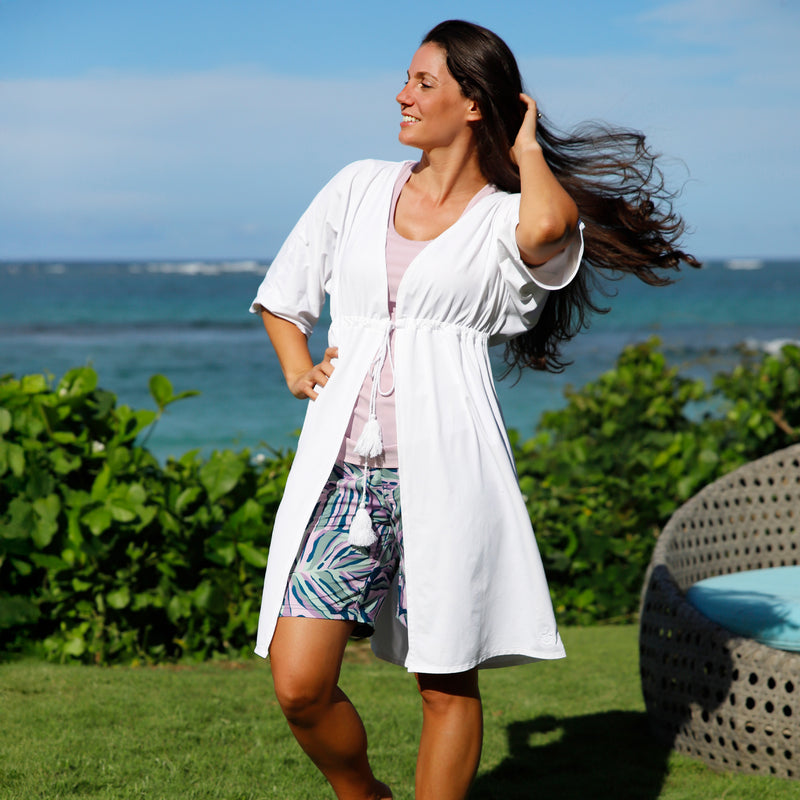 woman posing by the ocean in women's front tie sun kimono in white|white