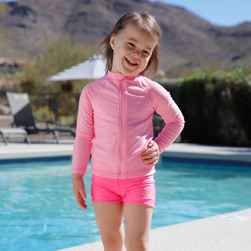 kid by pool in full zip rashguard|light-pink