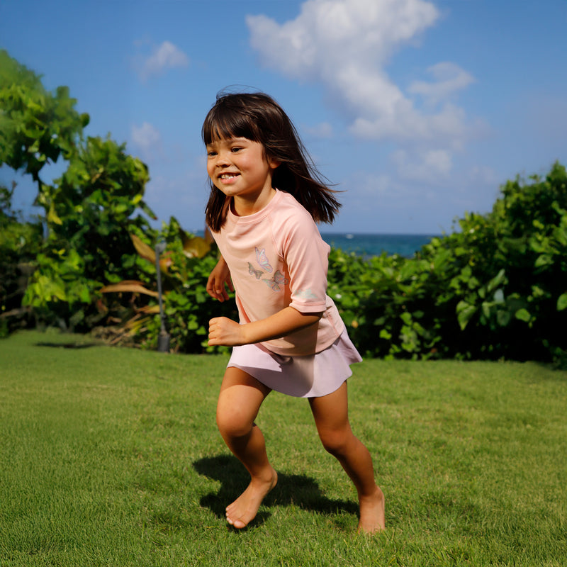 girl running in kids short sleeve crew sunny swim shirt in butterfly besties|butterfly-besties