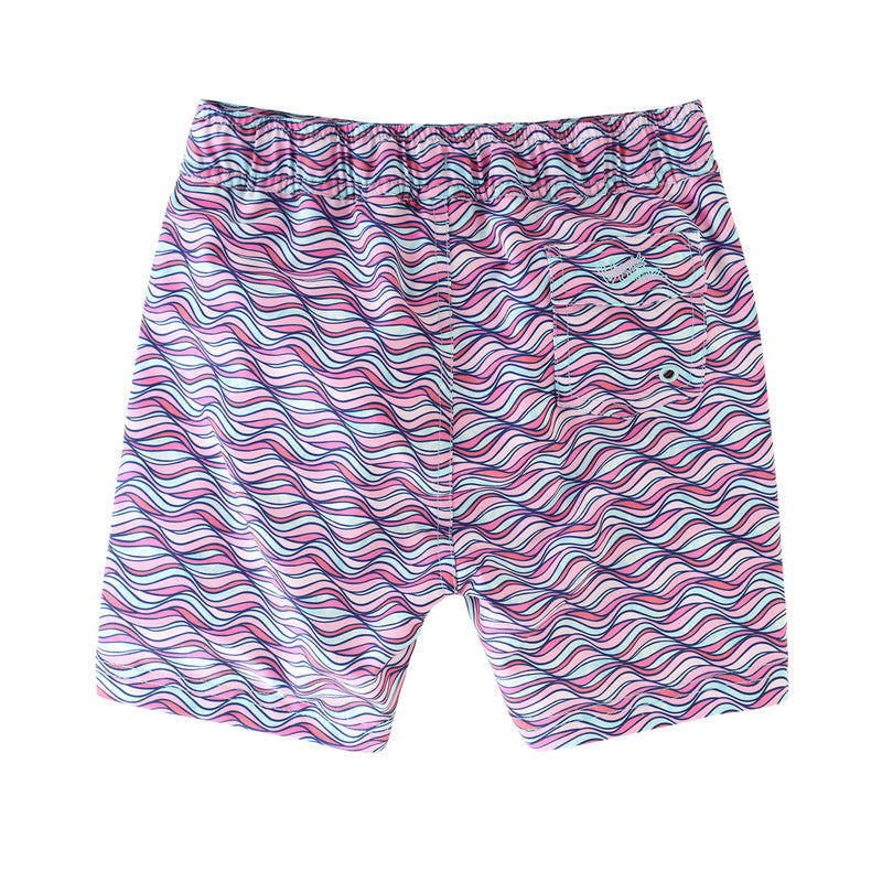 back view of the girl's board shorts in light pink waves|light-pink-waves