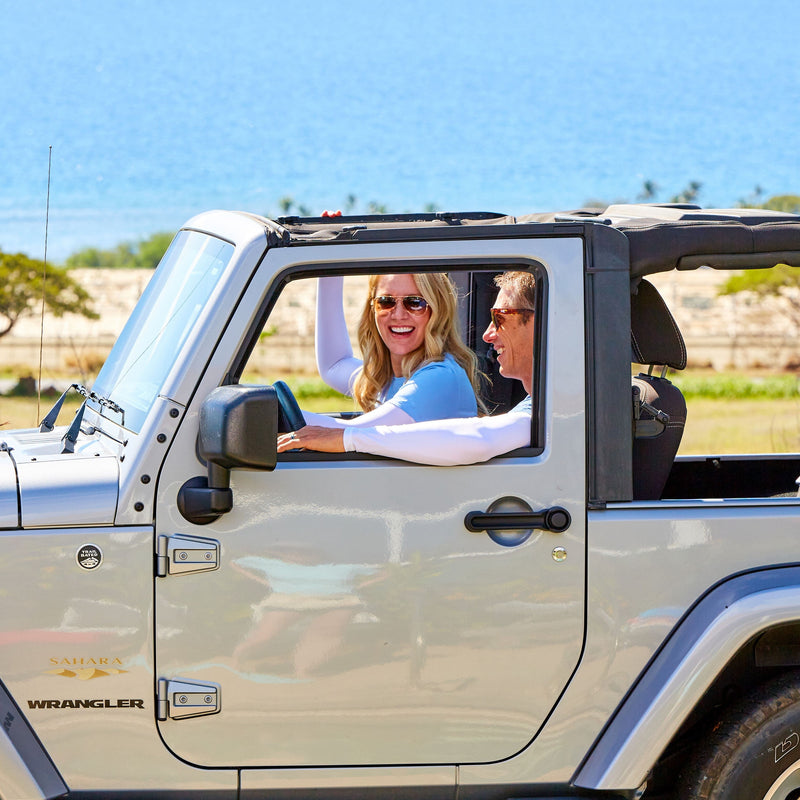 People driving in bamboo sun sleeves|sand