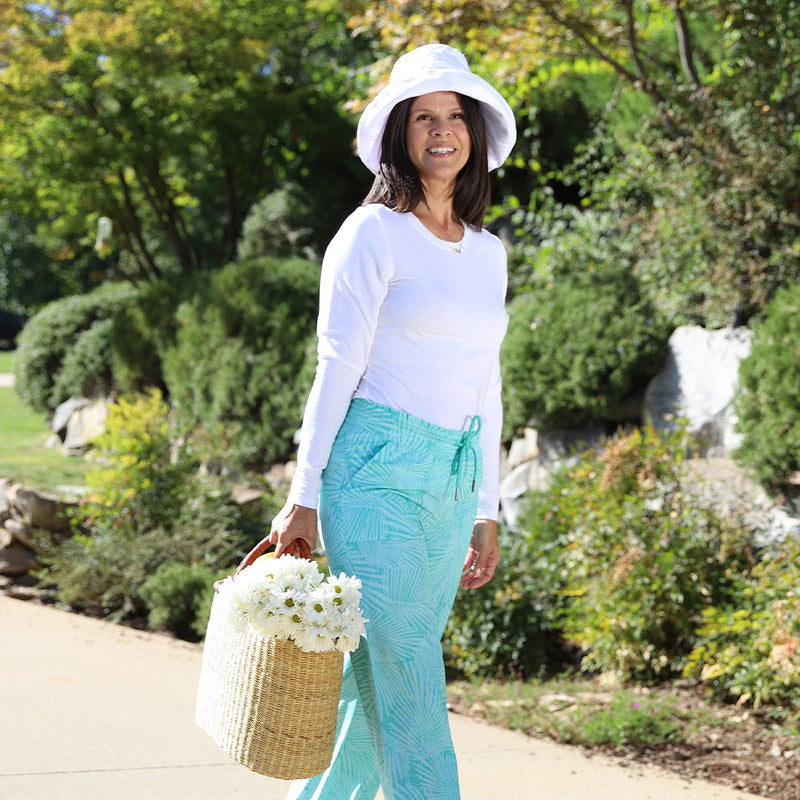 Woman Carrying a Basket of Flowers in the Women's Long-Sleeve Everyday Tee in White|white